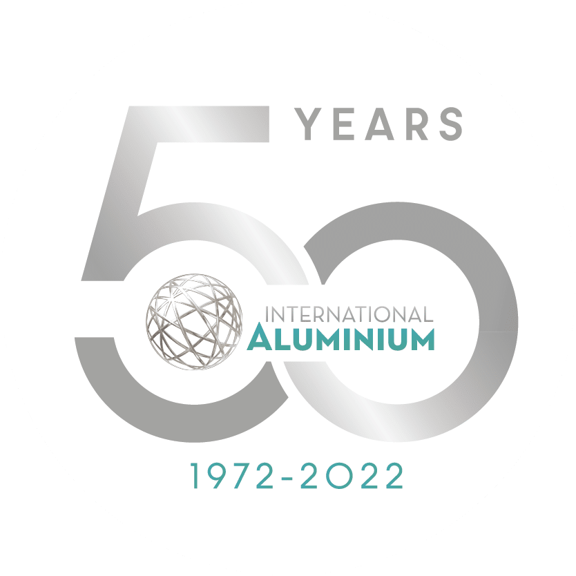 A round logo commemorating 50 years of the International Aluminium Institute from 1972 to 2022. The text "50 YEARS" is prominently displayed, with "International Aluminium" beneath it and "1972-2022" at the bottom. A globe icon is integrated into the "50," capturing significant moments in aluminium history.